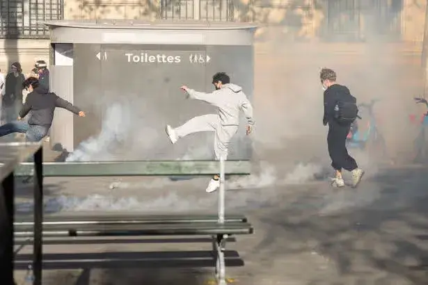 Paris riots leave one dead as looters torch buildings and smash stores