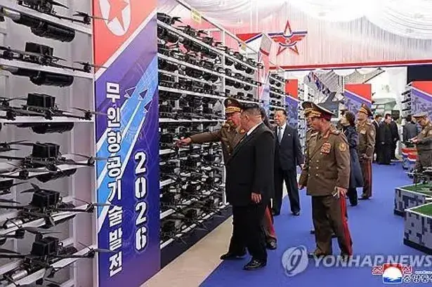 Kim Jong-un watches North Korea test 600mm multiple rocket launcher