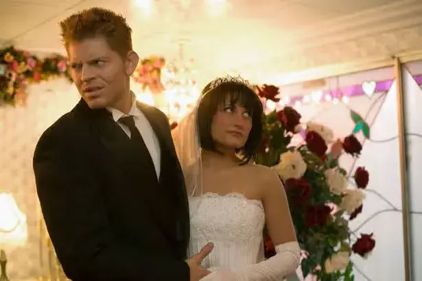Groom buries face in bride's chest instead of kissing her at altar